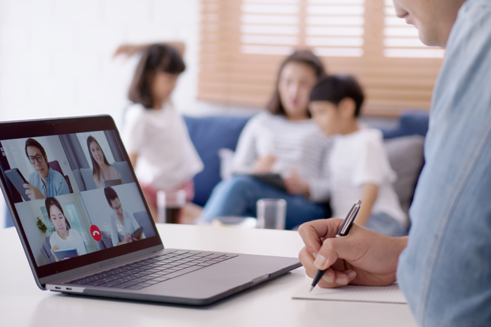 Asian business man stay with family and work remotely at home video conference remote call to corporate group. Meeting online,videocall, group discuss online concept.